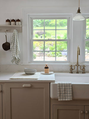 Enhance your kitchen with the Light Blue and Oatmeal Check Kitchen Towel Set, featuring two towels crafted from 100% cotton for softness and durability. The light blue and oatmeal tones, in a timeless check pattern, bring a refined cottage charm that complements any farmhouse, coastal, or rustic decor.