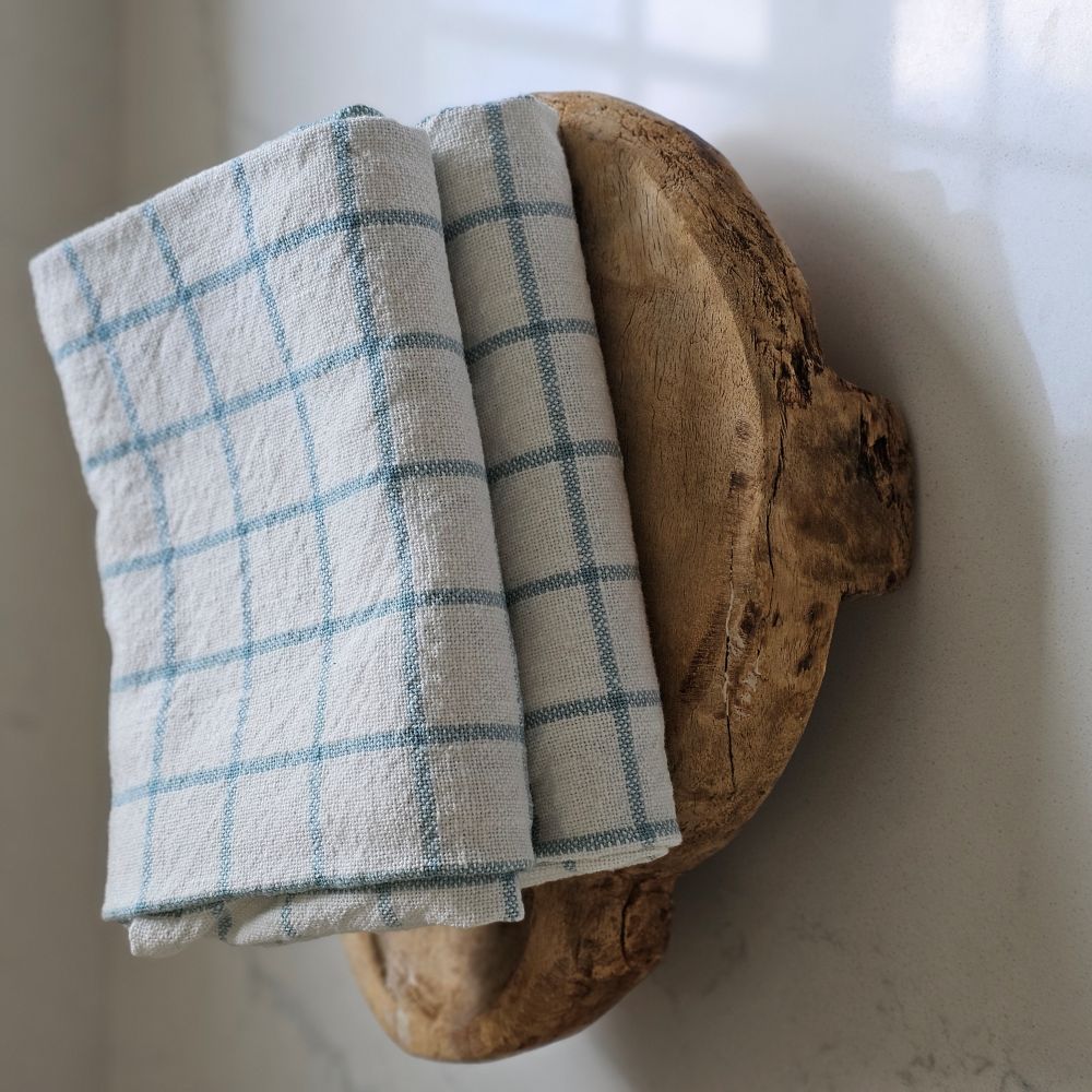 Enhance your kitchen with the Light Blue and Oatmeal Check Kitchen Towel Set, featuring two towels crafted from 100% cotton for softness and durability. The light blue and oatmeal tones, in a timeless check pattern, bring a refined cottage charm that complements any farmhouse, coastal, or rustic decor.