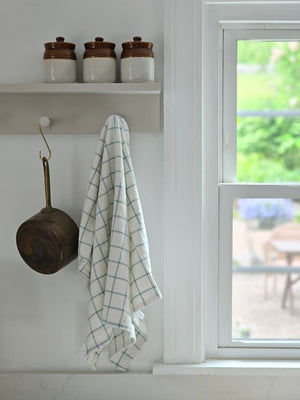 Enhance your kitchen with the Light Blue and Oatmeal Check Kitchen Towel Set, featuring two towels crafted from 100% cotton for softness and durability. The light blue and oatmeal tones, in a timeless check pattern, bring a refined cottage charm that complements any farmhouse, coastal, or rustic decor.