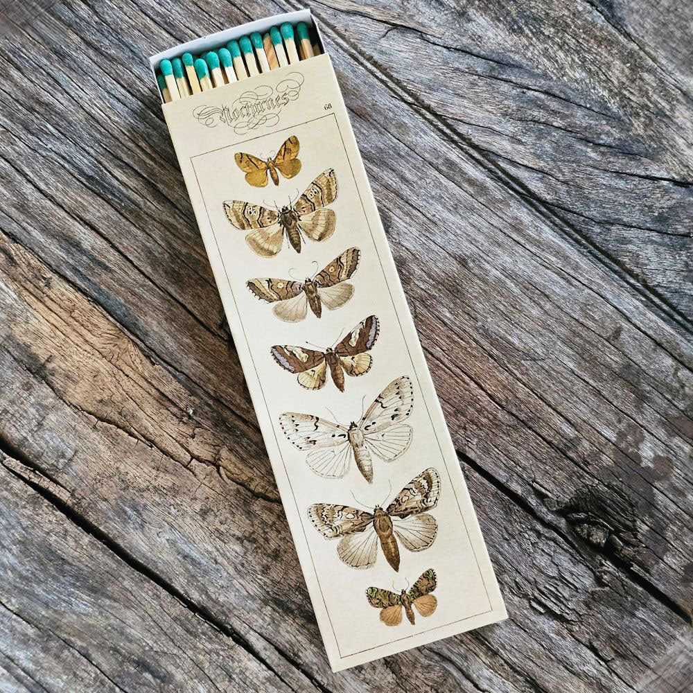 These stylish long wood matches, with a moth design inspired by old illustrations, are the perfect complement to any space. Modern, chic, with a vintage graphic design, they are perfect for any room. The match striker is side of the box for easy lighting. Safety matches, 50 sticks per cardboard box. 