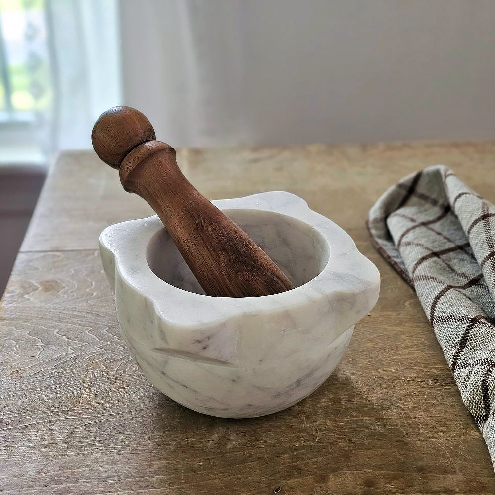With a vintage apothecary feel, our Marble Mortar with Wood Pestle is a great tool for the kitchen or bath. This workhorse is ready to help release all the flavors and scents of herbs and spices. Bowl is 6”Diam x 3”H, Wood Pestle is 5.75”L