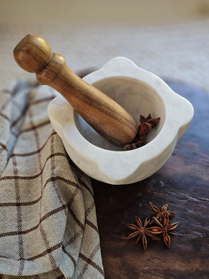 With a vintage apothecary feel, our Marble Mortar with Wood Pestle is a great tool for the kitchen or bath. This workhorse is ready to help release all the flavors and scents of herbs and spices. Bowl is 6”Diam x 3”H, Wood Pestle is 5.75”L