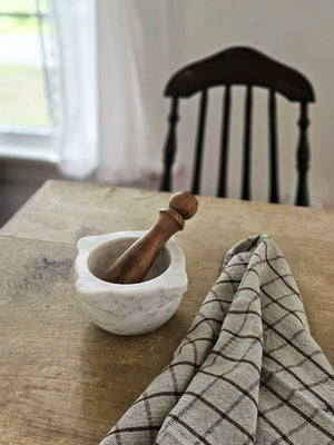 With a vintage apothecary feel, our Marble Mortar with Wood Pestle is a great tool for the kitchen or bath. This workhorse is ready to help release all the flavors and scents of herbs and spices. Bowl is 6”Diam x 3”H, Wood Pestle is 5.75”L