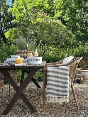 The Nautical Stripe Turkish Towel is an oversized towel revered for its quick drying ability. This charcoal and cream striped towel is inspired by ones found throughout historic Mediterranean beach towns on the French Riviera.

Made from finely loomed Turkish cotton, these towels are perfect for traveling, as they dry very quickly, are highly absorbent and pack very small. And they are not only for the beach, bath or pool, they have many other uses.
