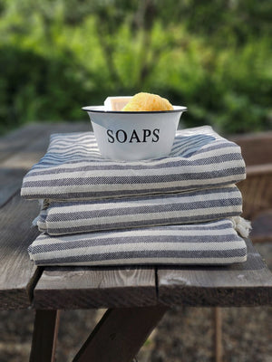 The Nautical Stripe Turkish Towel is an oversized towel revered for its quick drying ability. This charcoal and cream striped towel is inspired by ones found throughout historic Mediterranean beach towns on the French Riviera.

Made from finely loomed Turkish cotton, these towels are perfect for traveling, as they dry very quickly, are highly absorbent and pack very small. And they are not only for the beach, bath or pool, they have many other uses.