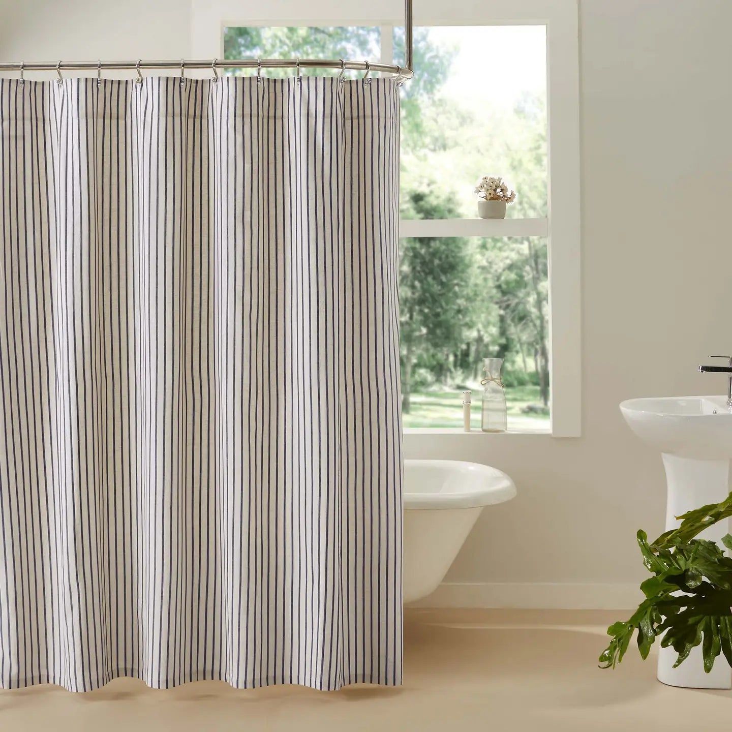 Whether you're going for coastal or country style, this Navy Blue Striped Shower Curtain&nbsp; offers classic, easy charm. &nbsp;Features dark navy and creamy-tan ticking stripes. Measures 72 by 72 inches to fit standard sized showers and baths. Easily hang this classic country bath curtain with shower hooks of your choosing (not included) using the button holes attached. A 3" rod pocket is also available as an alternative hanging method.