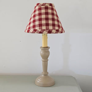 Our Nutmeg Metal Spindle Lamp with Buffalo Check Lampshade creates a cozy old cottage feel. Perfect for bedside tables and desktops, this lamp features a metal base with a warm colonial tan finish. It is topped off with a clip on buffalo check lampshade in black and tan or red and tan. This lamp plugs in and has an on/off switch built into the cord. Uses a 40 watt max B or C candelabra bulb (Bulb not included.). 