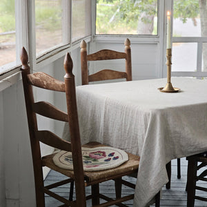 Relaxed farmhouse elegance is made easy with this Oatmeal Linen Tablecloth. The earthy flax color creates an instant vintage feel inspired by old European farmhouse style. Washed linen is know for its softness and texture. This natural linen will quickly become a treasured heirloom. 100% Linen. Made in the USA