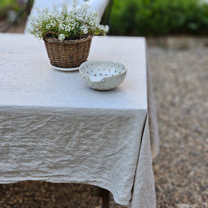 Relaxed farmhouse elegance is made easy with this Oatmeal Linen Tablecloth.  The earthy flax color creates an instant vintage feel inspired by old European farmhouse style. Washed linen is know for its softness and texture. This natural linen will quickly become a treasured heirloom. 100% Linen. Made in the USA