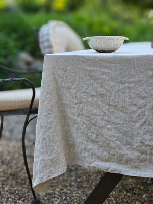 Relaxed farmhouse elegance is made easy with this Oatmeal Linen Tablecloth.  The earthy flax color creates an instant vintage feel inspired by old European farmhouse style. Washed linen is know for its softness and texture. This natural linen will quickly become a treasured heirloom. 100% Linen.