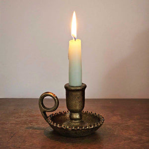 This Old World Gold Chamberstick Taper Candle Holder features a distressed gold patina that makes it feel like an antique heirloom. Holds a regular size taper candle. It is made of metal with a highly distressed finish. Candle not included.