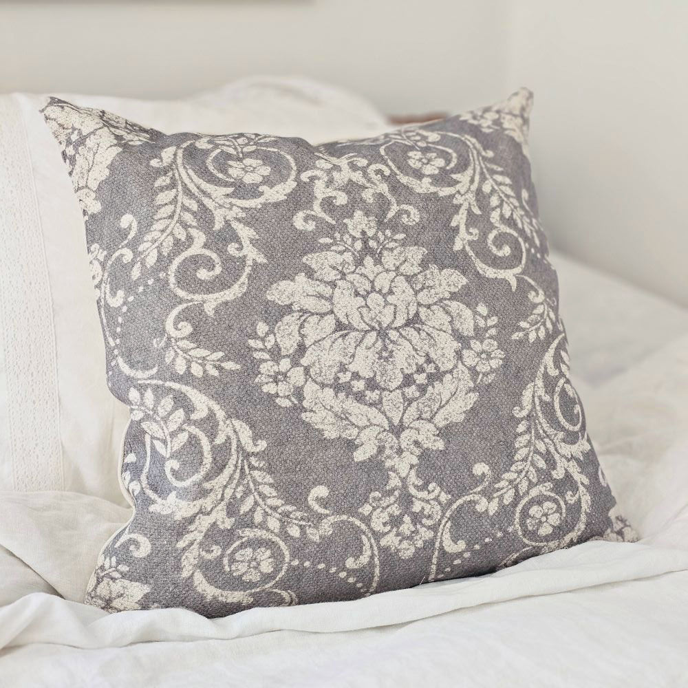 The Old World Grey Floral Pillow brings a touch of French Country cottage style to any room. Featuring a soft fabric that has a slightly aged look, making it feel as though it was found in a Paris flea market. The floral pattern has old-world charm that will instantly add a vintage touch. The cover is easy-to-remove with its zipper closure. Spot clean only. 100% cotton cover with Polyester insert. 18" x 18"