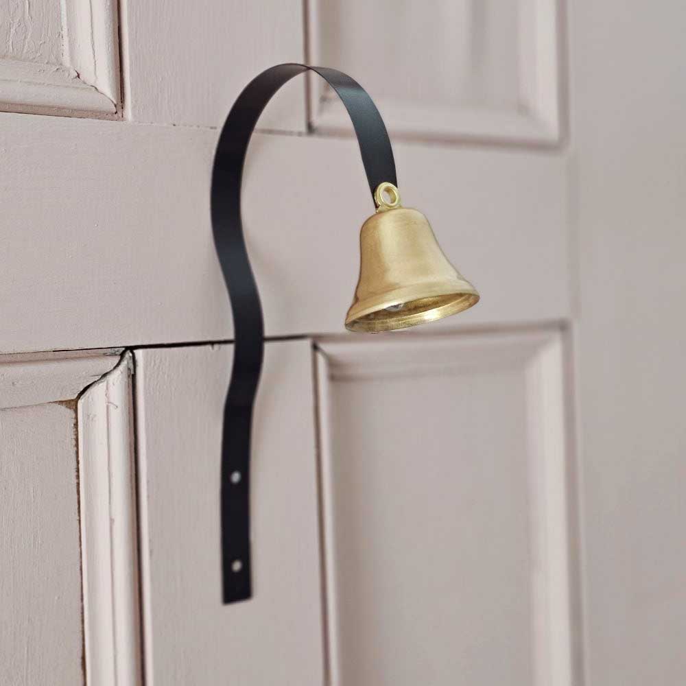 Our Old Butler Style Door Bell transports you to a Downton Abbey style kitchen. Just like general store door bells, one jolly ring of this brass bell and you’ll be reminded of the scent of worn-wood floors and penny candy from your favorite old country store. This bell mounts to your door, and when the door is opened, the bell moves and rings to let you know you have company. Or, hang it down low and train your dog to ask to be let out. Put it in a office so you know when someone arrives. It is a low 