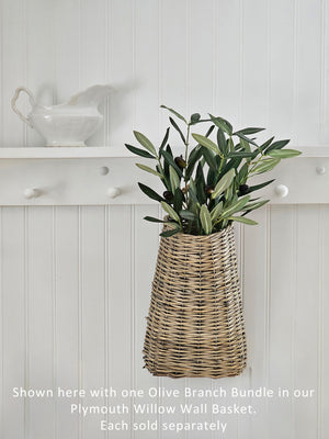 This Olive Branch Bundle is full of rustic beauty. Crafted with lifelike detail, this faux tree branch features lush blue/green leaves and realistic olive fruit that will fill any vase or basket with old-world charm. Perfect for adding a touch of Mediterranean flair to your home. 12"H