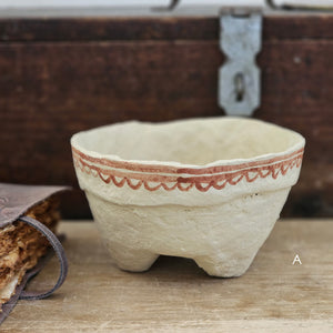 Handcrafted in the time-honored fashion and painted using a traditional henna technique, each Paper Mache Kashmir Bowl bring a unique character. Offered in four different patterns, each piece is one of a kind and are a beautiful accent for a bookshelf or a casual catchall. For decorative use only. Each bowl sold separately. 5.75" Diam x 3.75"H