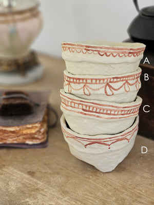 Handcrafted in the time-honored fashion and painted using a traditional henna technique, each Paper Mache Kashmir Bowl bring a unique character. Offered in four different patterns, each piece is one of a kind and are a beautiful accent for a bookshelf or a casual catchall. For decorative use only. Each bowl sold separately. 5.75" Diam x 3.75"H