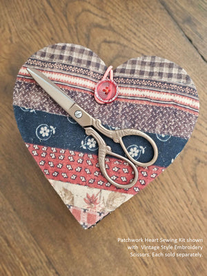 Our Patchwork Heart Sewing Kit has most everything you need for quick fixes and small projects. Perfect for travel or for the new homeowner or college student. It features a cushioned heart that folds out to reveal four sides filled with sewing notions, including 1 tape measure, 1 folding scissors, 3 thread colors, 3 safety pins, 3 sewing needles, 4 mother of pearl buttons, 1 seam ripper, and 1 needle threader. 6"L x 5"W x 2"H