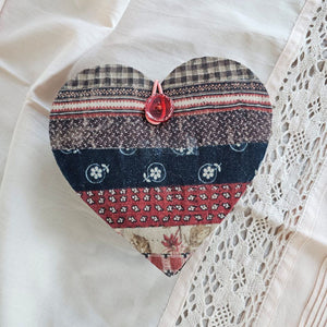 Our Patchwork Heart Sewing Kit has most everything you need for quick fixes and small projects. Perfect for travel or for the new homeowner or college student. It features a cushioned heart that folds out to reveal four sides filled with sewing notions, including 1 tape measure, 1 folding scissors, 3 thread colors, 3 safety pins, 3 sewing needles, 4 mother of pearl buttons, 1 seam ripper, and 1 needle threader. 6"L x 5"W x 2"H