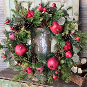 Add Colonial character to your home with our Pine Cones and Pomegranates Wreath. Mixed greenery is loaded with pomegranates, pine cones, and small pods to create a collection abounding in interesting components and charm. 24"