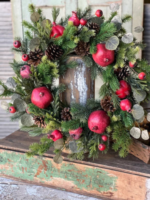 Add Colonial character to your home with our Pine Cones and Pomegranates Wreath. Mixed greenery is loaded with pomegranates, pine cones, and small pods to create a collection abounding in interesting components and charm. 24"