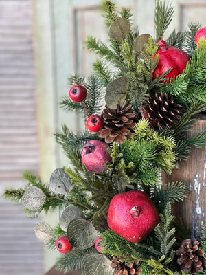 Add Colonial character to your home with our Pine Cones and Pomegranates Wreath. Mixed greenery is loaded with pomegranates, pine cones, and small pods to create a collection abounding in interesting components and charm. 24"