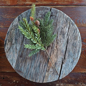 Our Pine Greens with Hemlock Sprig Pick makes a great filler for baskets and holiday arrangements. The faux pine greens with pine cones and a sprig of hemlock brings fresh, earthy greenery to your farmhouse decor. Perfect for adding cabin style or a rustic twist, this realistic greenery provides a charming decorative accent all year long. Includes one pick. 