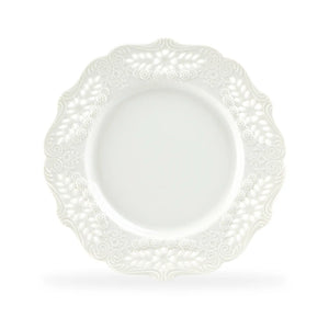 This creamy white porcelain dinner plate marries vintage charm with refined elegance. Featuring hand-detailed embossed flowers and delicate cutout lace work, the gracefully scalloped edge evokes timeless sophistication. Whether gracing your everyday table or reserved for special gatherings, this single plate serves as a subtle statement of cultivated taste and enduring style. Food safe. Microwave safe. Hand wash recommended. Each sold separately. 10" Diam