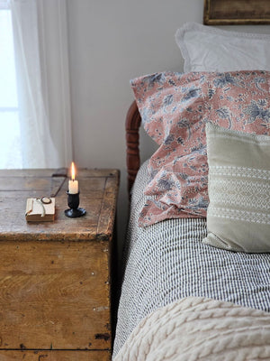 Add a cozy and refreshing look to your farmhouse style bedroom with the Portsmouth Blue Ticking Stripe Quilt. This Americana quilt evokes a feeling of cool ocean breezes and vintage vibes, featuring popular ticking stripes in denim blue and light beige with quality seersucker material to enjoy for years to come. This hand-quilted, 100% cotton coverlet gets softer with each washing.