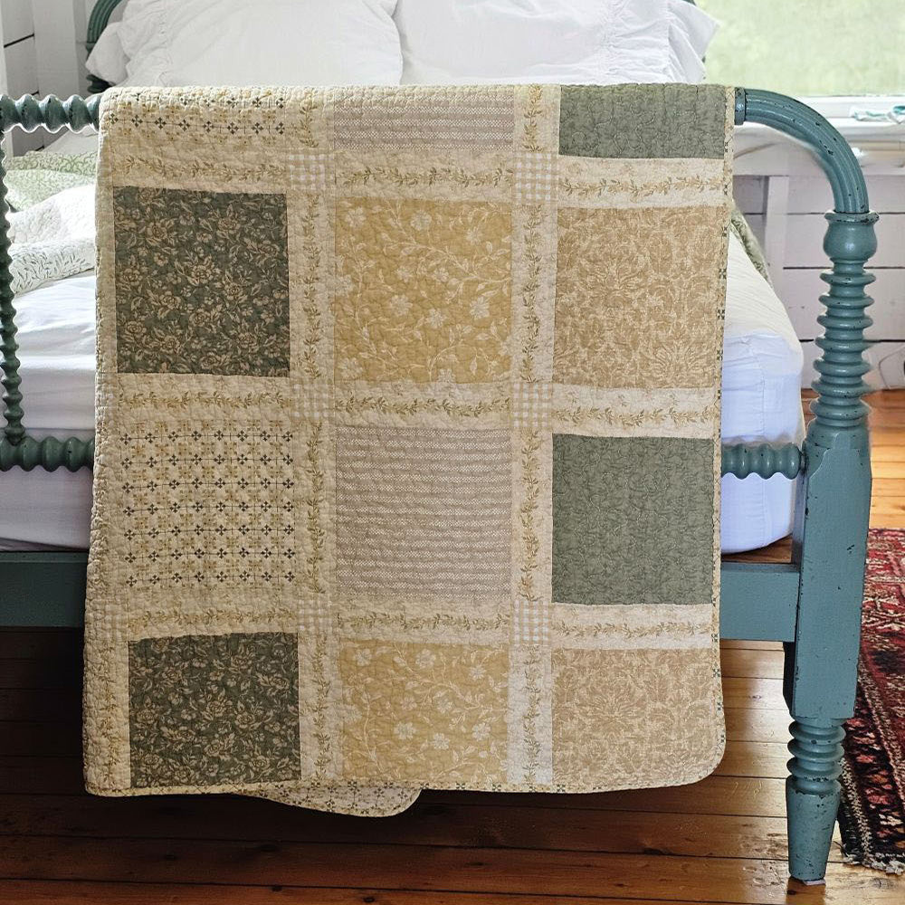 Prairie Meadow Patchwork Quilt Throw Blanket is made of 100% cotton. Featuring a classic patchwork design in soothing shades of sage green, beige, white, buttercream gold, and cream, this throw adds a serene, cottage-inspired touch to any space. Crafted with a 100% soft cotton cover, it’s lightweight yet warm—perfect for year-round use. The elegant patchwork quilted throw reverses to a printed pattern for two looks in one!