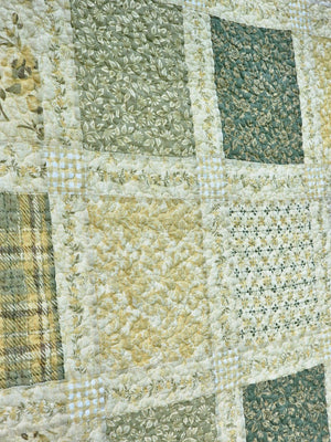 Add a cozy, vintage farmhouse feel to a guest room or reading nook with this quilted throw. Our Prairie Meadow Patchwork Quilt Throw Blanket is made of 100% cotton. Featuring a classic patchwork design in soothing shades of sage green, beige, white, buttercream gold, and cream, this throw adds a serene, cottage-inspired touch to any space. Crafted with a 100% soft cotton cover, it’s lightweight yet warm—perfect for year-round use.