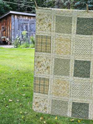 Add a cozy, vintage farmhouse feel to a guest room or reading nook with this quilted throw. Our Prairie Meadow Patchwork Quilt Throw Blanket is made of 100% cotton. Featuring a classic patchwork design in soothing shades of sage green, beige, white, buttercream gold, and cream, this throw adds a serene, cottage-inspired touch to any space. Crafted with a 100% soft cotton cover, it’s lightweight yet warm—perfect for year-round use.