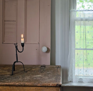 Crafted in the style of an antique reproduction, this candle holder pays homage to our Colonial heritage. Its timeless beauty suits both Early American homes and rustic farmhouses. The tripod style Primitive Wrought Iron Table Taper Candle Holder with a twist features an aged finish, protected by a durable lacquer coating to ensure resistance to scratches and rust, guaranteeing lasting appeal. 