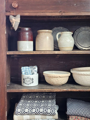 This handsome Jelly and Jam Crock is inspired by 19th century ironstone from potteries throughout England. This reproduction crock has a creamy white color with a decorative black old-timey logo. This beautiful accent crock adds old-world charm to any room. Use to store cooking utensils or display your favorite flowers.