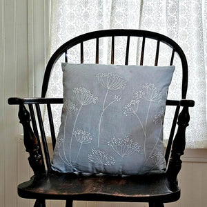 The Embroidered Queen Anne's Lace Pillow brings timeless botanical charm to any room with its delicate embroidered design. Rendered in soft powder blue with crisp white embroidery, this accent pillow captures the ethereal beauty of Queen Anne's Lace flowers—a classic motif that complements cottage, farmhouse, and traditional decor styles.