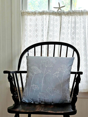 The Embroidered Queen Anne's Lace Pillow brings timeless botanical charm to any room with its delicate embroidered design. Rendered in soft powder blue with crisp white embroidery, this accent pillow captures the ethereal beauty of Queen Anne's Lace flowers—a classic motif that complements cottage, farmhouse, and traditional decor styles.