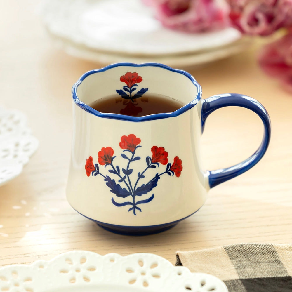 The Red White and Blue Folk Art Flower Mug is a cheerful ceramic mug for coffee, tea and more. Whether your style is country, coastal, vintage or farmhouse, this folk art mug lends a ton of charm to any cuppa.