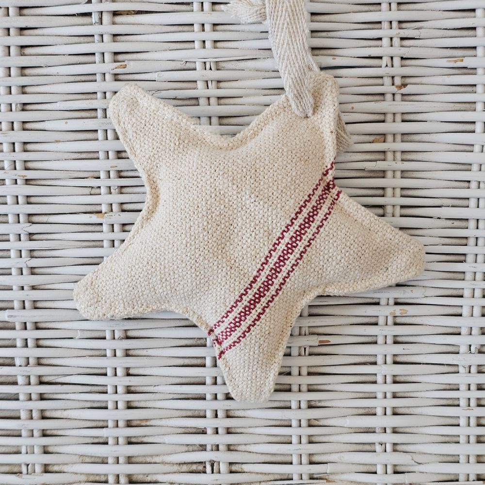Our Red Stripe Grain Sack Star Ornament looks so charming whether you're Christmas style is French Country, Vintage Farmhouse, or classic Nordic style. This fabric star ornament offers an old-fashioned look, inspired by French grain sacks. 100% Cotton. 5.25" Diam