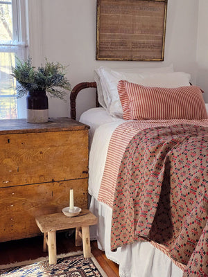 Whether you're creating a farmhouse style bedroom, a cozy cabin nook or a cottage guest room, our Red Ticking Stripe Quilt offers vintage charm. This hand-quilted, 100% cotton coverlet gets softer with each washing. Features popular ticking stripes in red along with a buttery oat stripe on one side and a solid buttery oat on the reverse side.