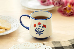 The Red White and Blue Folk Art Flower Mug is a cheerful ceramic mug for coffee, tea and more. Whether your style is country, coastal, vintage or farmhouse, this folk art mug lends a ton of charm to any cuppa.