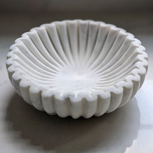 Elevate your table setting with the Ribbed Marble Bowl, featuring a refined ribbed texture and delicate light grey veining. This elegant piece combines natural beauty with subtle sophistication, making it perfect for creating unique displays. Its timeless design adds a touch of understated luxury to any space.