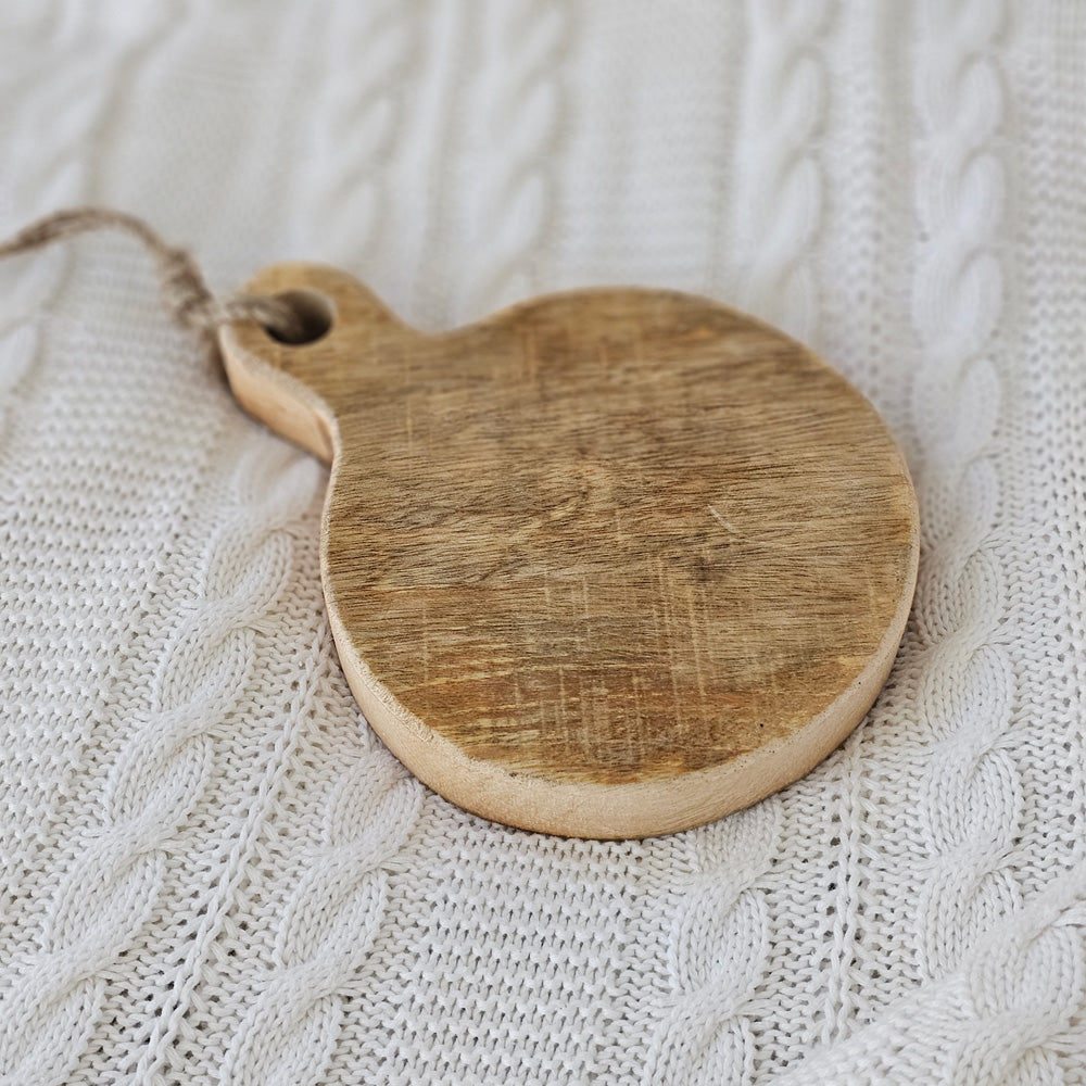 The Round Chunky Wood Cutting Board Coaster adds a decorative touch to any table . The rustic style board is perfect as a countertop display or hanging from hooks. For decorative use only. 7.5"L x 5.5"W x 1"H