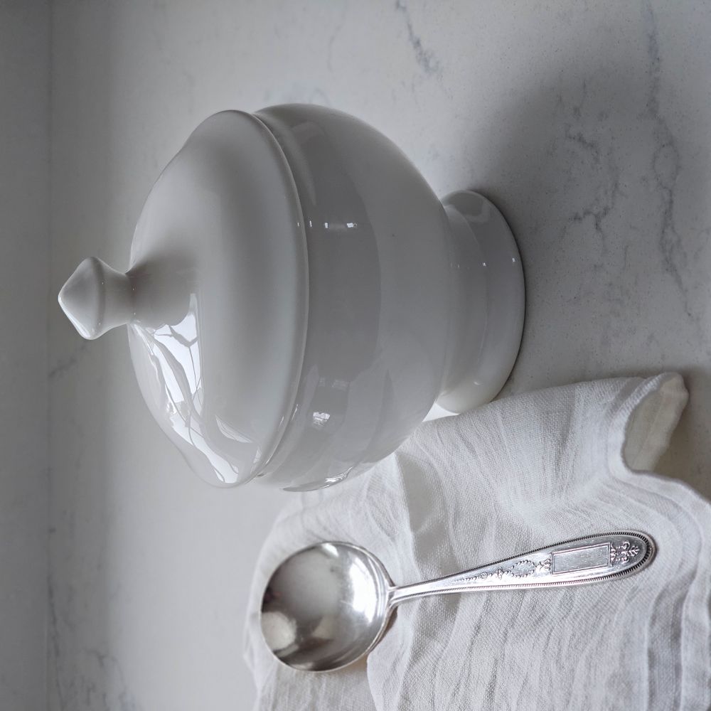 Serve up soups and stews in style with our Round White Soup Bowl with Lid. Craft individual servings and create an elegant presentation. This mini round tureen features a lid to ensure your dishes stay warm as you dazzle your guests with a stunning setting. The exquisite design captures the essence of sophistication, making it a focal point on any dining table. Made of durable ceramic that is microwave and dishwasher safe. Includes one Round White Soup Bowl with Lid. 14 fl oz., 4.25 Diam, 5.25"H with 