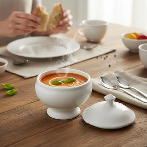 Serve up soups and stews in style with our Round White Soup Bowl with Lid. Craft individual servings and create an elegant presentation. This mini round tureen features a lid to ensure your dishes stay warm as you dazzle your guests with a stunning setting. The exquisite design captures the essence of sophistication, making it a focal point on any dining table. Made of durable ceramic that is microwave and dishwasher safe. Includes one Round White Soup Bowl with Lid. 14 fl oz., 4.25 Diam, 5.25"H with 