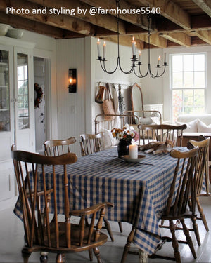 The Rustic Blue Check Tablecloth offers a versatile design choice for any farmhouse. The bold blue and rustic tan buffalo check design create a combination that works with so many decor styles. Whether it's French Country, English cottage or rustic farmhouse, this accent adds a charming touch