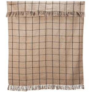 Get cozy and transform your favorite space with the refined style and complete comfort of this Rustic Black Windowpane Throw Blanket. This woven cotton throw features a black grid design on a rustic beige weave with tassels on top and bottom. This soft throw is perfect for creating a cozy home no matter the season. Crafted of 100% cotton, finished with a tassel edges, this throw is machine washable for easy care. 50"W x 60"H
