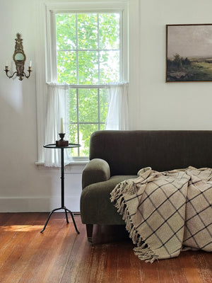 Get cozy and transform your favorite space with the refined style and complete comfort of this Rustic Black Windowpane Throw Blanket. This woven cotton throw features a black grid design on a rustic beige weave with tassels on top and bottom. This soft throw is perfect for creating a cozy home no matter the season. Crafted of 100% cotton, finished with a tassel edges, this throw is machine washable for easy care. 50"W x 60"H