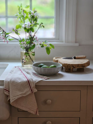 The Rustic Ceramic Pasta Bowls, Set of Two, is the perfect size for serving up pasta dishes and more. This wide bowl has a low profile and features a cool gray-white speckled glaze and ribbed design. It brings an earthy elegance to your farmhouse kitchen. Set of Two.