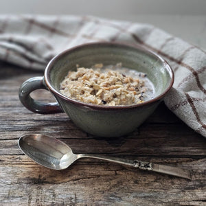 Embrace warmth and comfort with the Rustic Ceramic Soup Mug. Handcrafted with care, this earthy ceramic mug is designed to warm your hands while holding your favorite soups, stews, oatmeal, or hot beverages. Finished with a reactive glaze, each piece features unique variations in color and speckling, adding an organic and artisanal touch to your tableware collection.