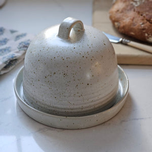 Keep butter close at hand with our Rustic French Butter Dish with Dome. Perfect style for old country kitchens, this generously sized ceramic dish can hold two sticks of butter. 6.75" Diam x 5.25"H