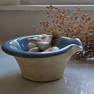 The Rustic Pour Bowl with Blue Glaze lends a vintage, old-world farmhouse look to any kitchen. It features a rustic hand-thrown pottery look with pour spout. The cottage blue glaze and unglazed bottom add to its rustic feel. 